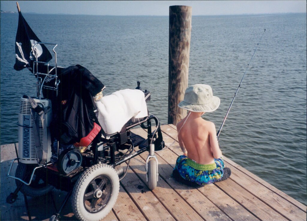 Mattie Stepanek appreciating a moment of silence while fishing on a pier, summer 1999.
